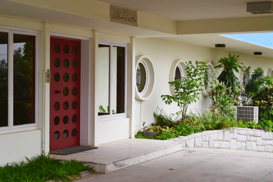 Striking red door in this retro Karachi home.