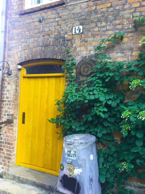 Vibrant yellow doors in Oslo (above) and Karachi (below)